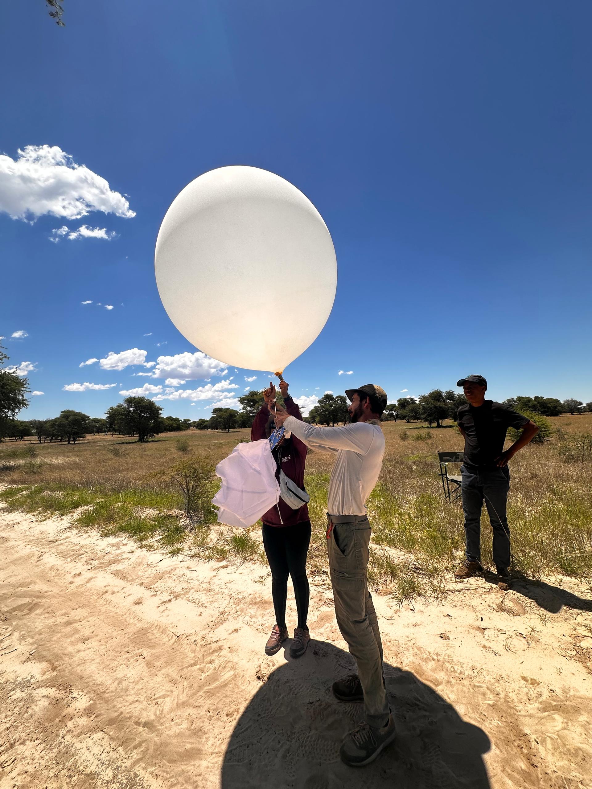 Launching a radiosonde for vertical atmospheric profiling in the Kgalagadi District.